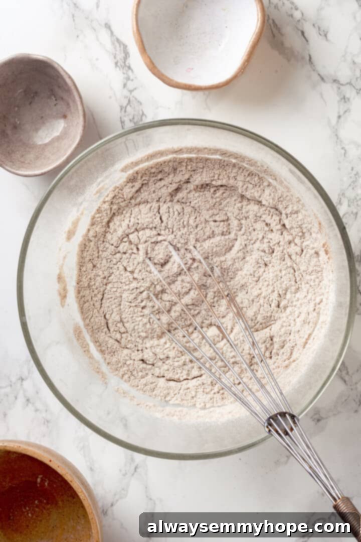 Dry ingredients in mixing bowl with whisk, thoroughly combined