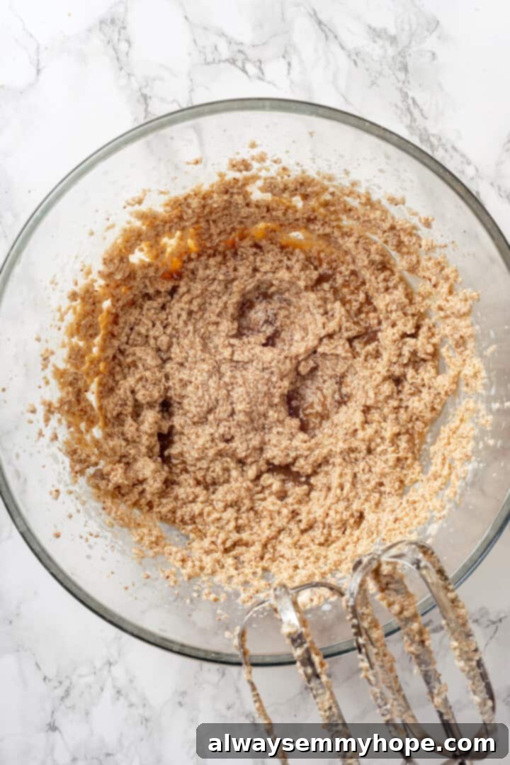 Creamed vegan butter and sugar in mixing bowl, showing light and fluffy texture