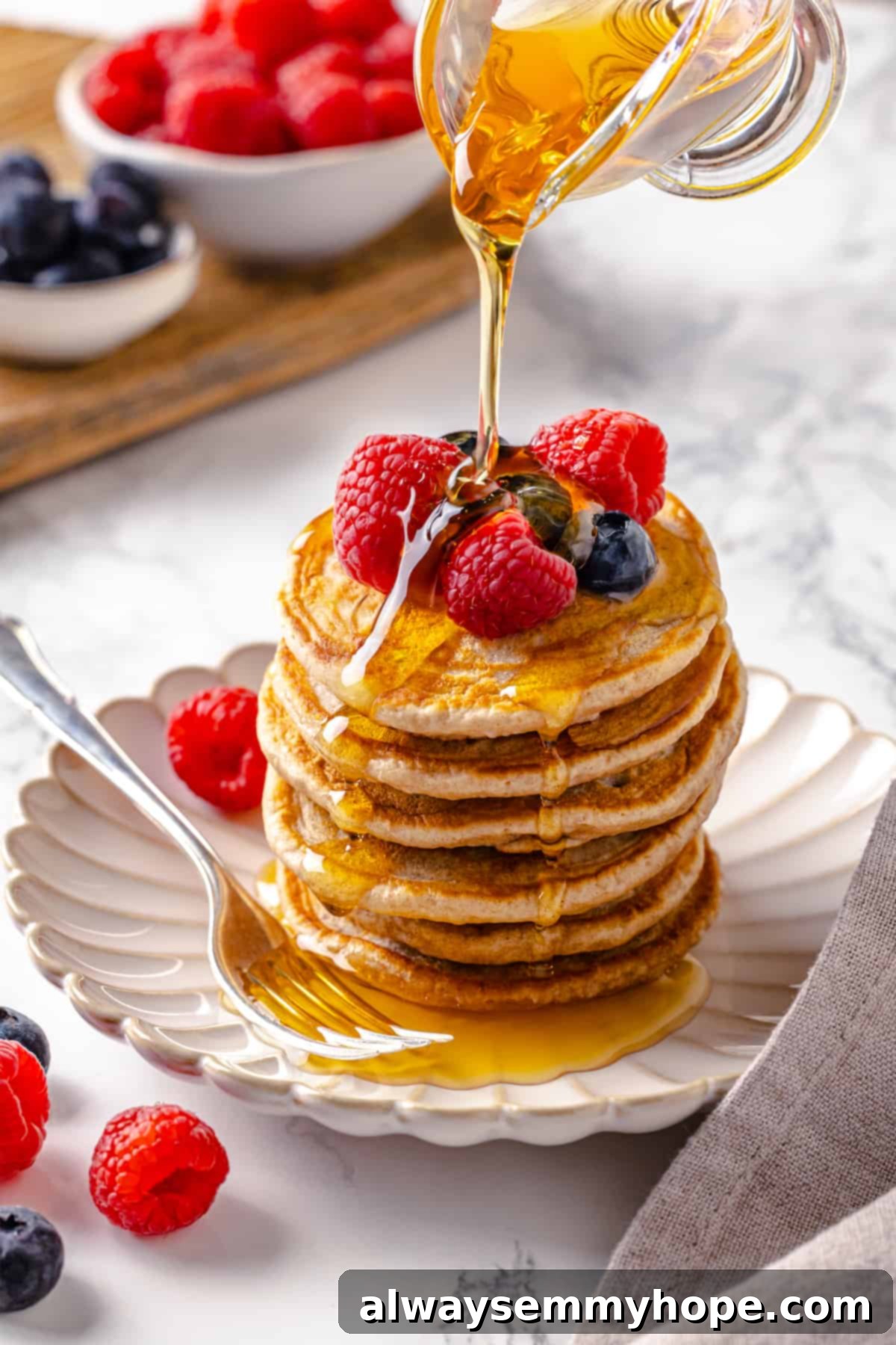 Pouring syrup onto silver dollar pancakes