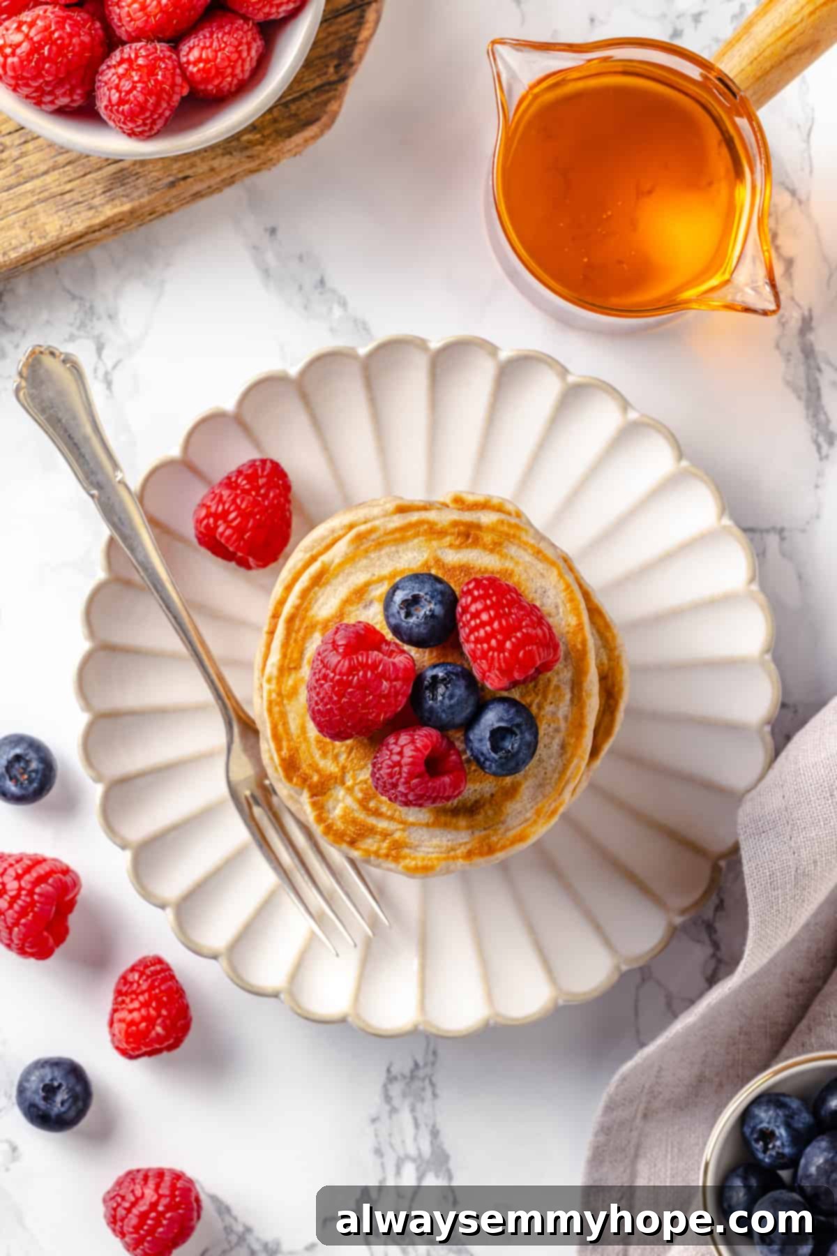 Overhead view of vegan silver dollar pancakes on plate