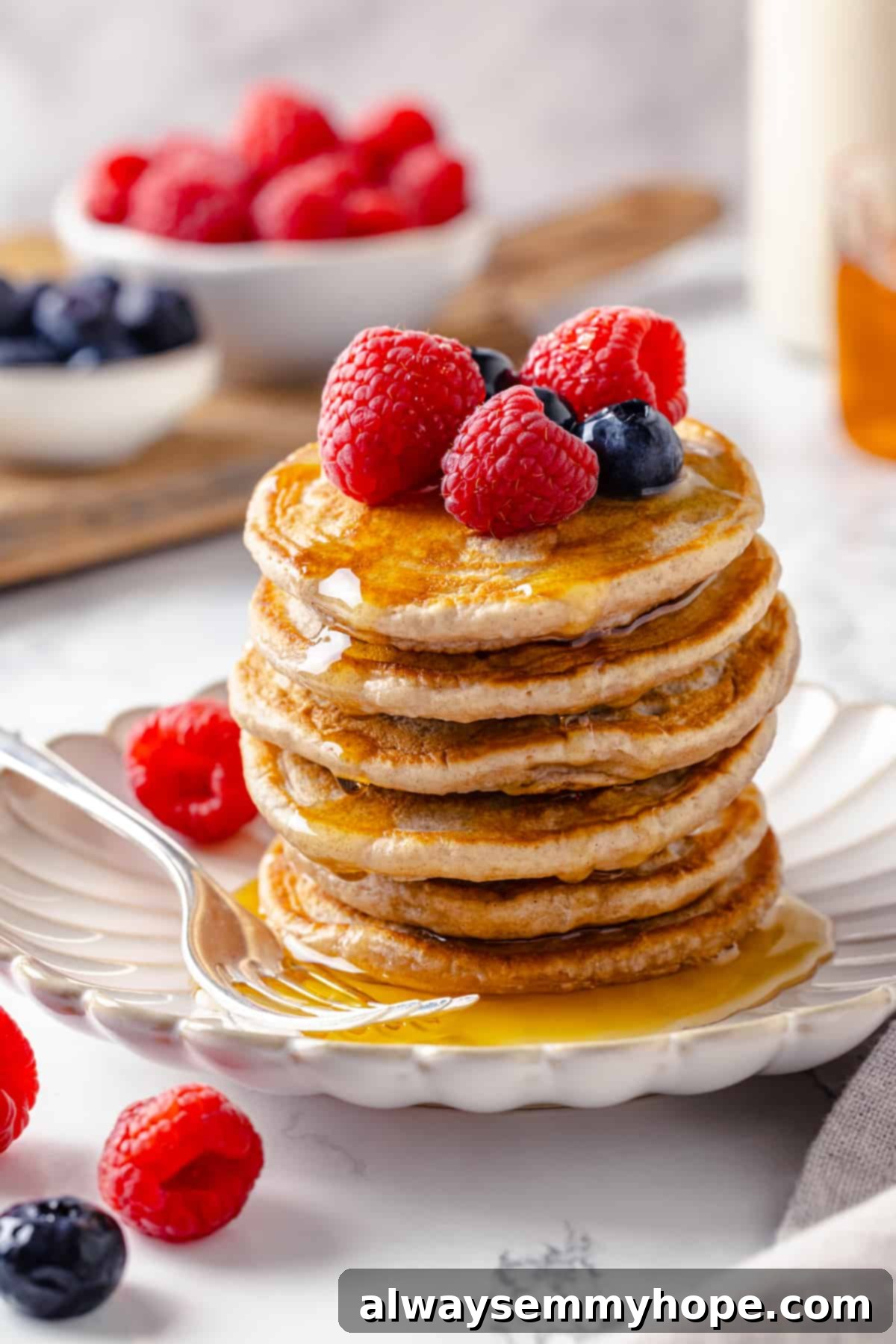 Vegan silver dollar pancakes stacked on plate