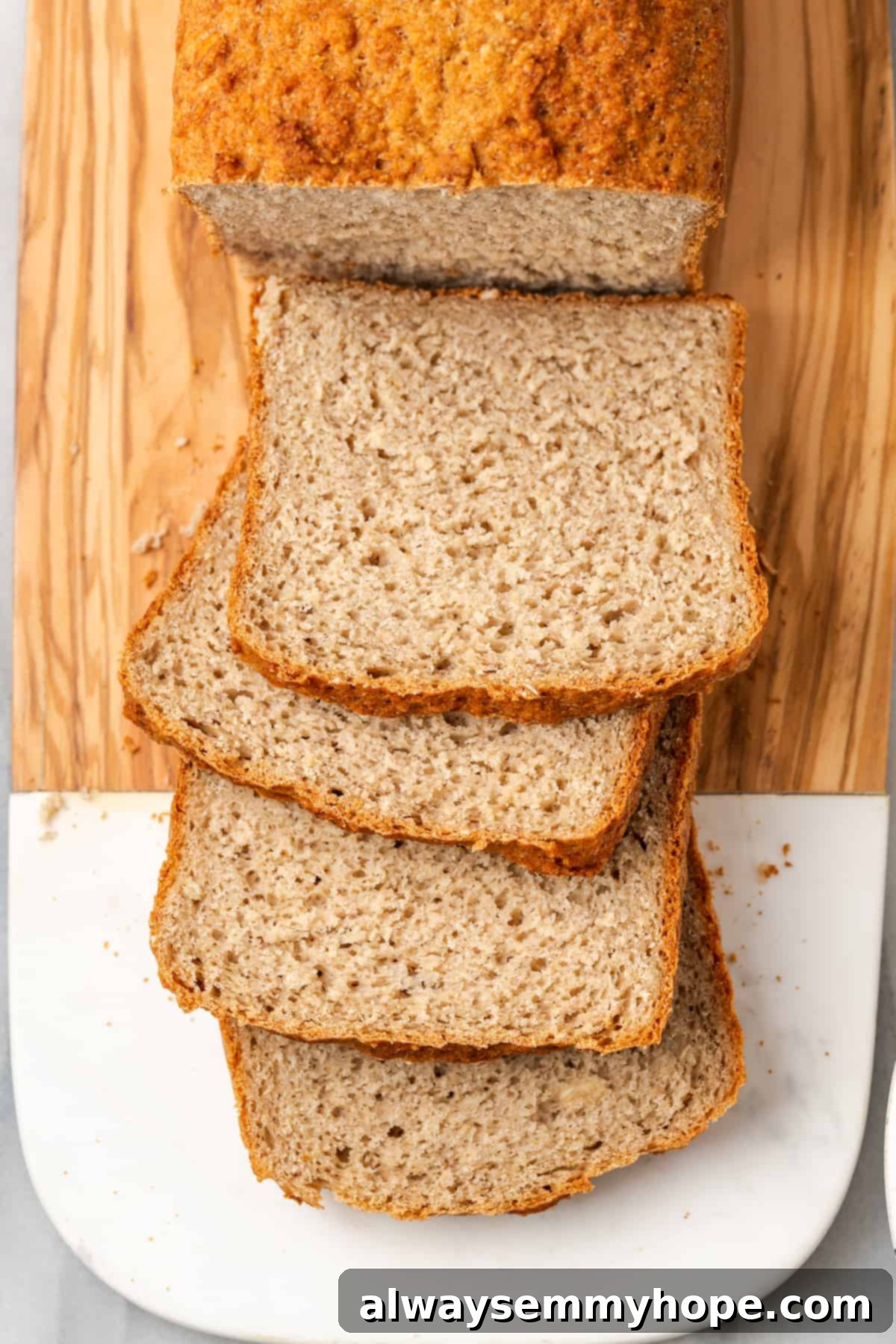 Overhead view of sliced gluten-free sandwich bread on cutting board
