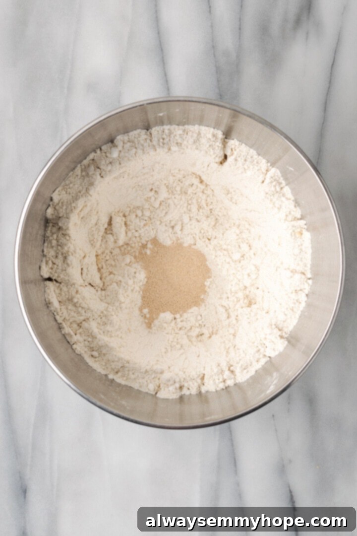 Overhead view of yeast added to dry ingredients for gluten-free sandwich bread