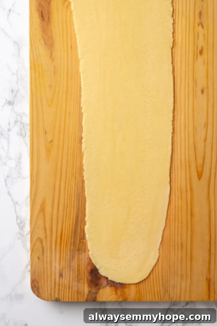 Butternut squash ravioli is fun to make at home and the results are delicious. Tender pasta pockets filled with creamy, caramelized squash! Pasta sheet on board