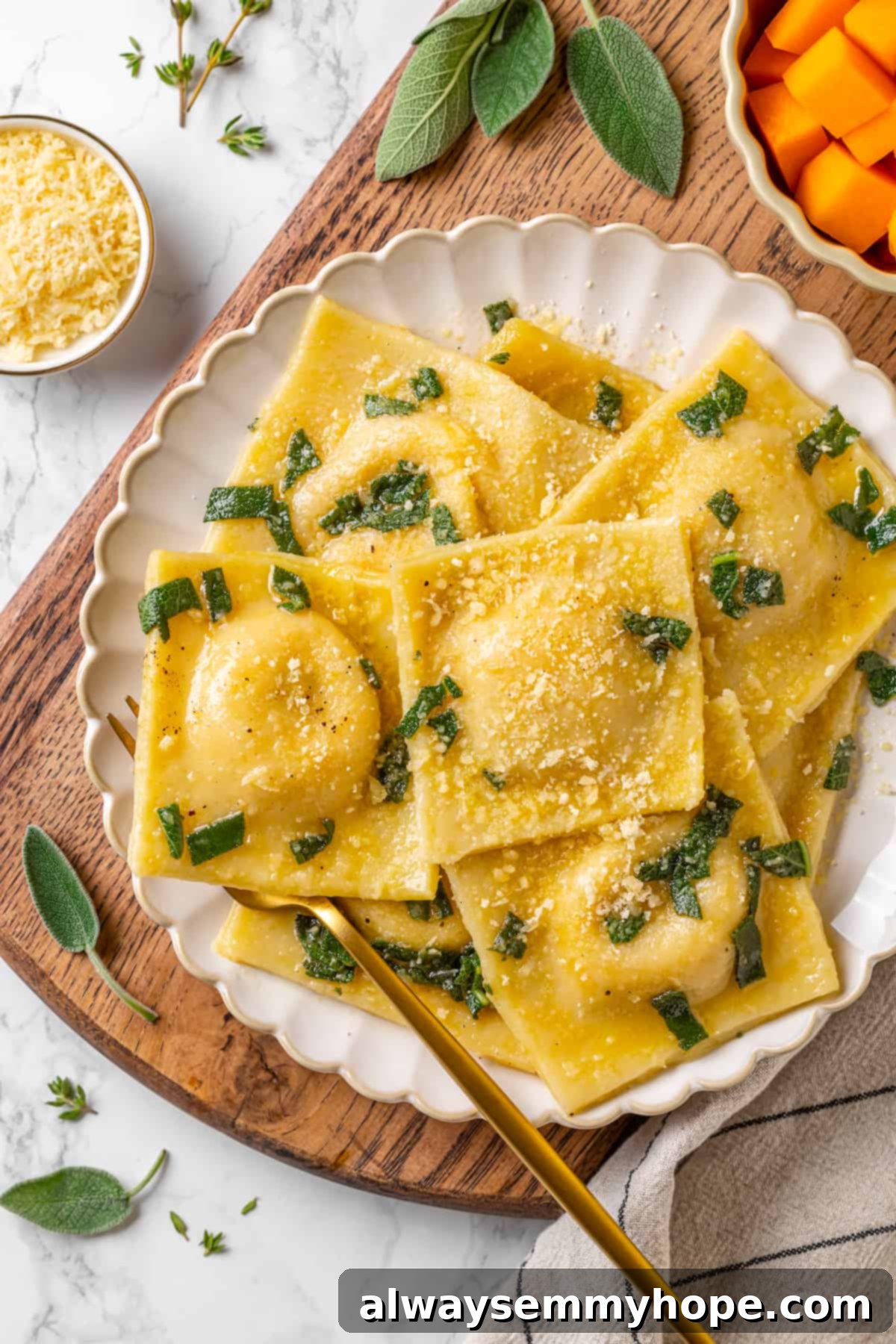 Butternut squash ravioli is fun to make at home and the results are delicious. Tender pasta pockets filled with creamy, caramelized squash! Overhead view of butternut squash ravioli on plate