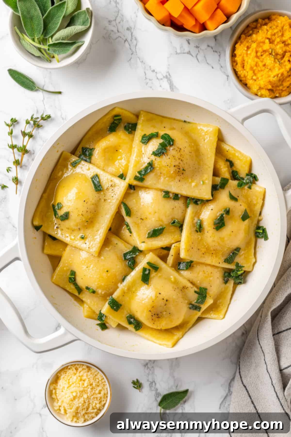 Butternut squash ravioli is fun to make at home and the results are delicious. Tender pasta pockets filled with creamy, caramelized squash! Butternut squash ravioli in pan with sage and brown butter sauce