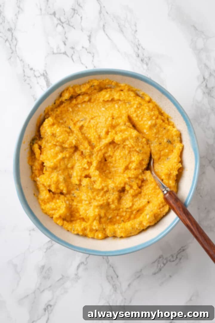 Butternut squash ravioli is fun to make at home and the results are delicious. Tender pasta pockets filled with creamy, caramelized squash! Overhead view of butternut squash ravioli filling in bowl