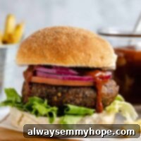 Effortless Grilled Veggie Burgers 3 Black bean burger with onion and lettuce.