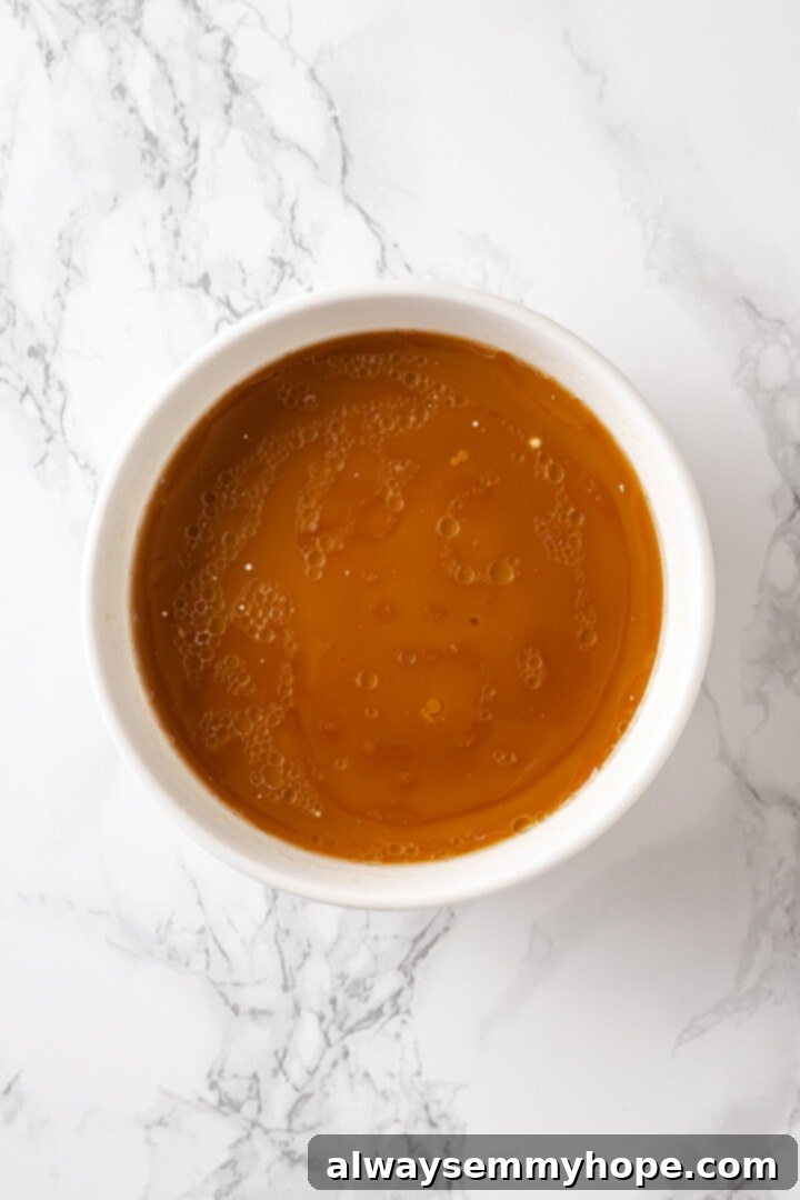 Overhead view of the prepared moo goo gai pan sauce in a small bowl