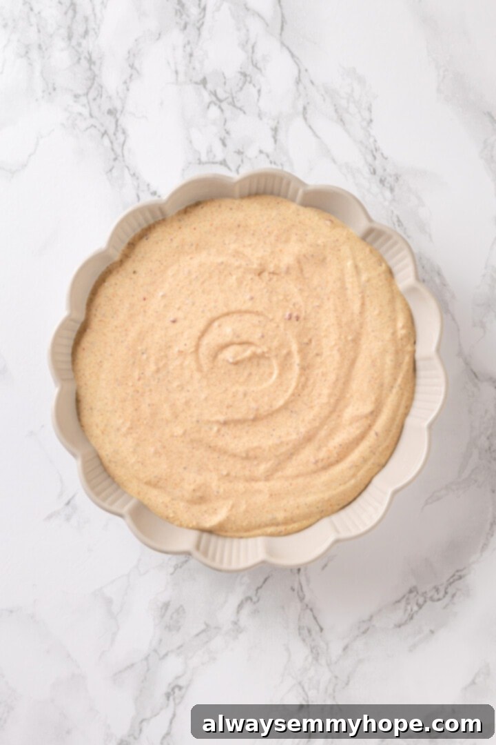 The perfectly smooth and creamy seasoned base for your vegan taco dip, ready for topping with fresh ingredients. Close-up of the perfectly creamy and smooth seasoned base for vegan taco dip in a bowl