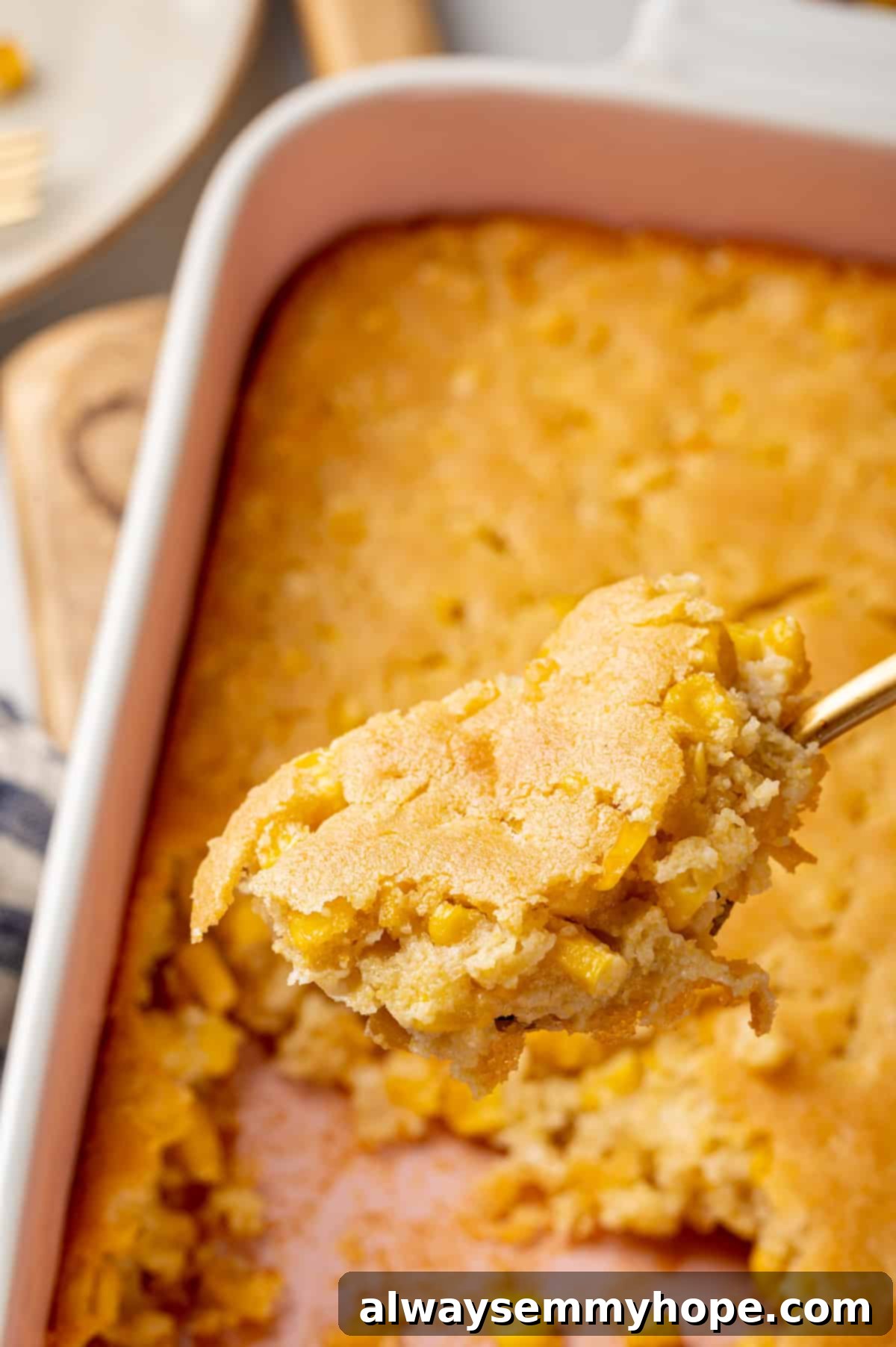 Corn soufflé is a classic holiday side dish, but easy enough to make for a weeknight! You’ll love the sweet flavour and creamy texture. Close-up of a spoonful of fluffy vegan corn soufflé against a blurred background