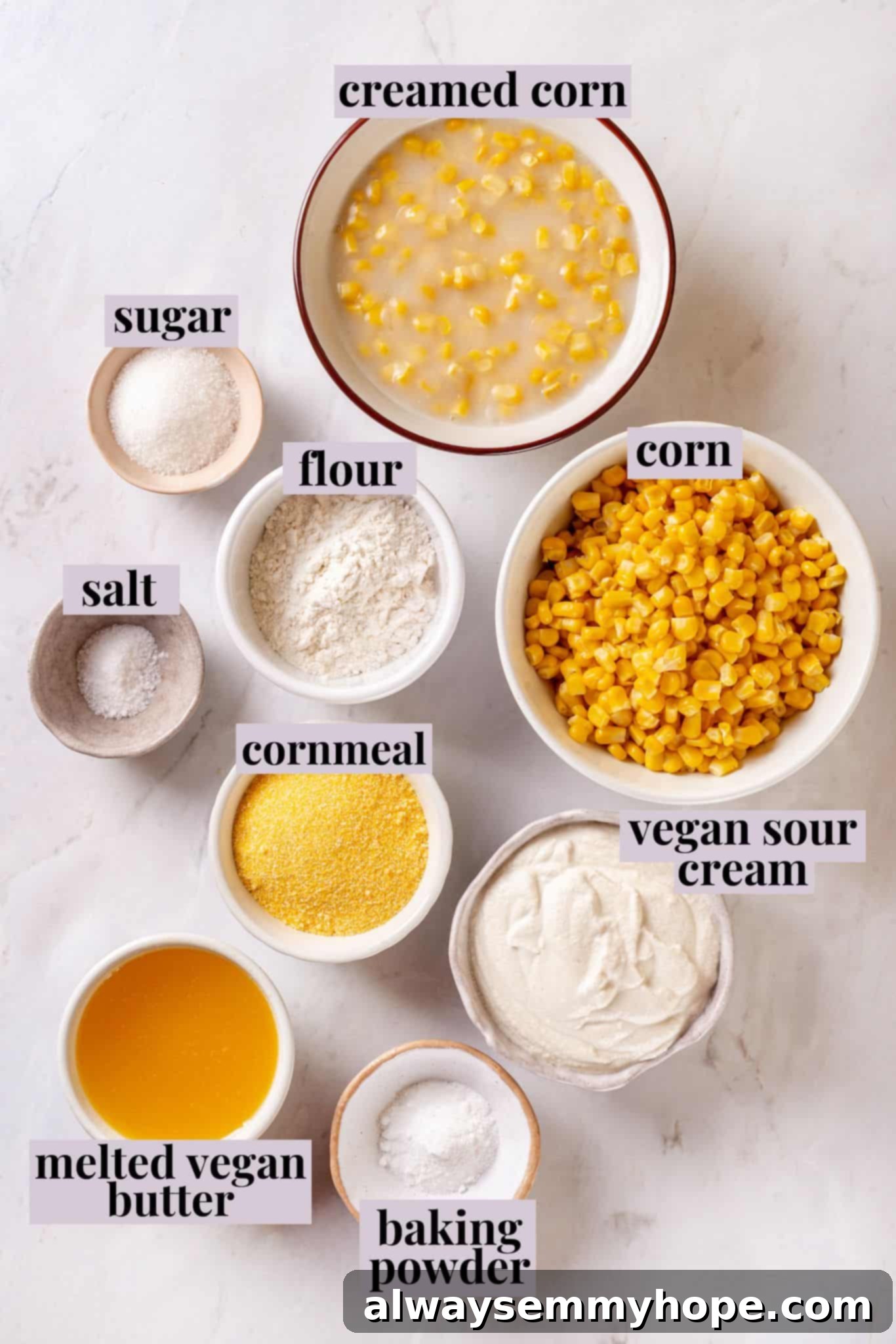 Corn soufflé is a classic holiday side dish, but easy enough to make for a weeknight! You’ll love the sweet flavour and creamy texture. Overhead view of all ingredients for vegan corn soufflé, neatly labeled on a counter