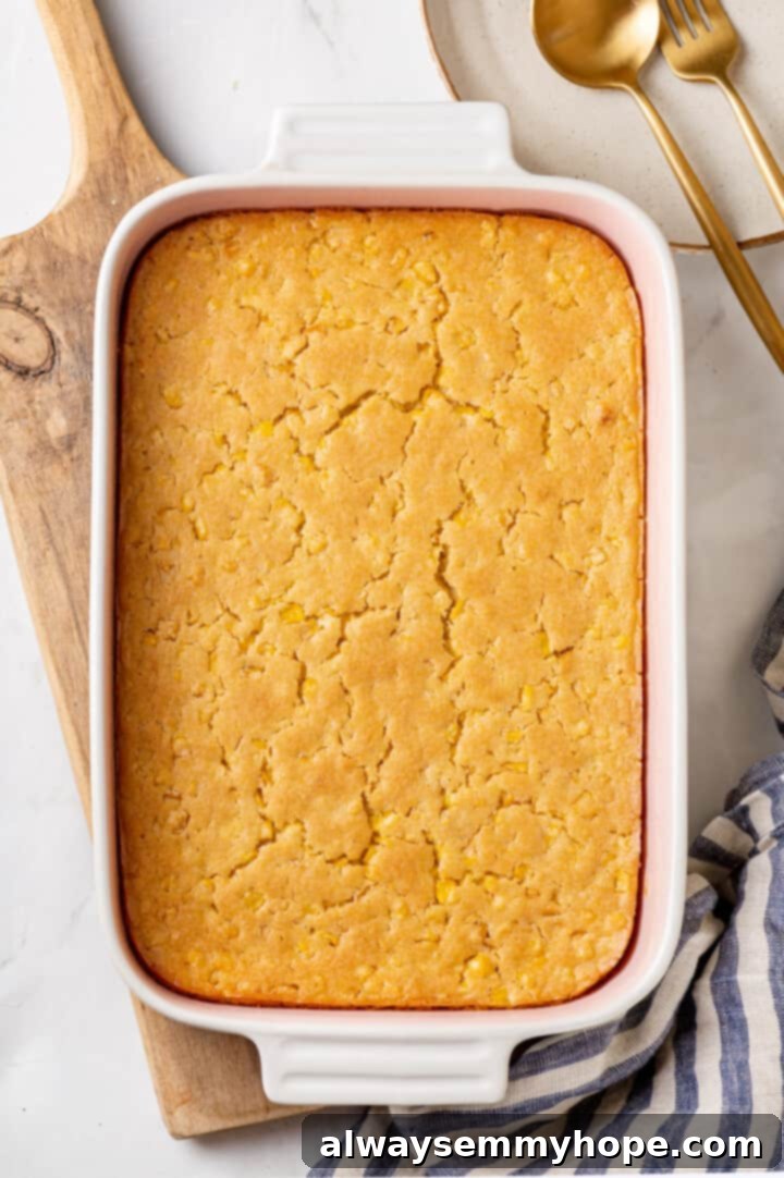 Corn soufflé is a classic holiday side dish, but easy enough to make for a weeknight! You’ll love the sweet flavour and creamy texture. Overhead view of unbaked corn soufflé batter in a 9x13 inch baking dish, ready for the oven