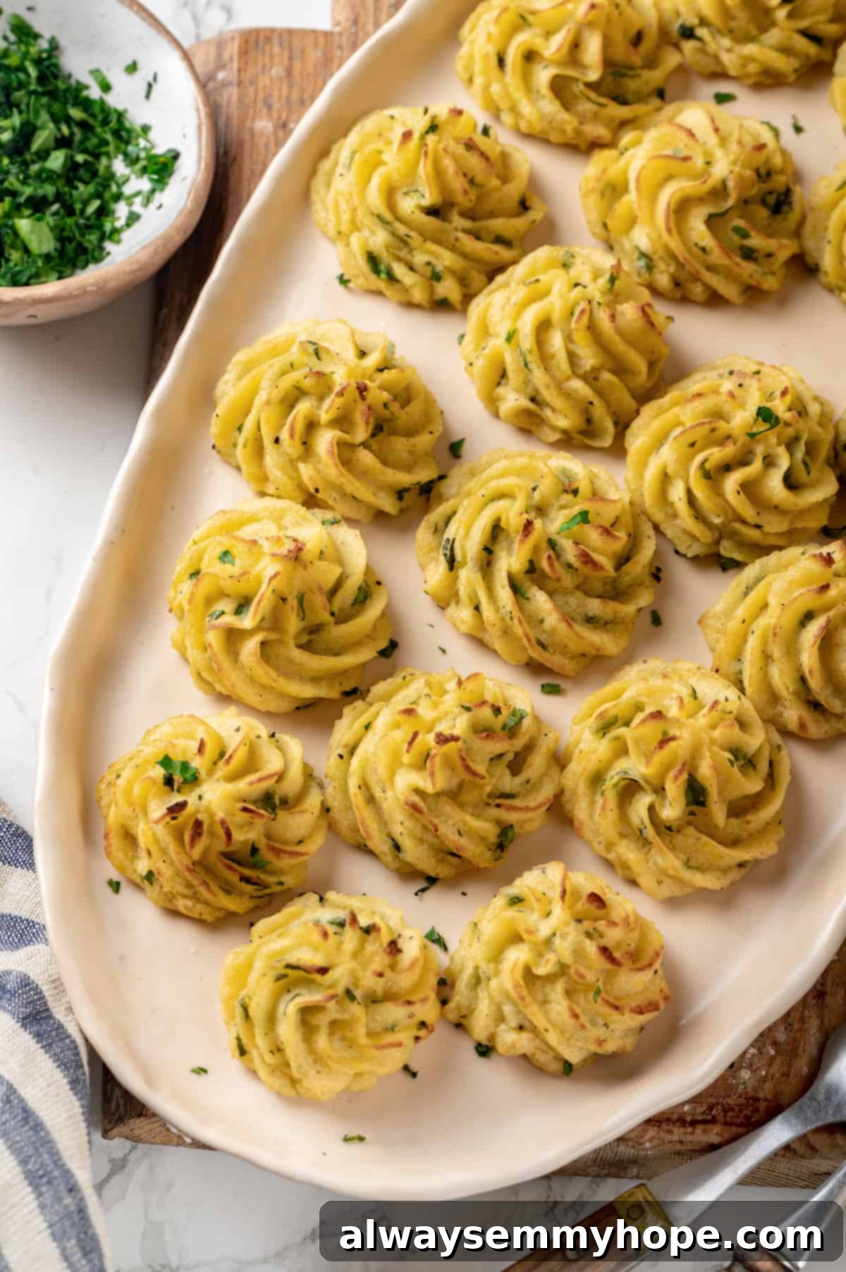 Platter of beautifully arranged vegan duchess potatoes