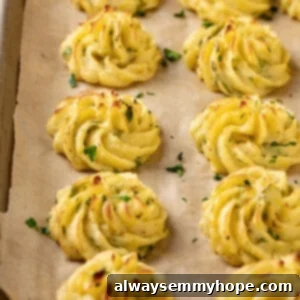 Pan of duchess potatoes topped with herbs