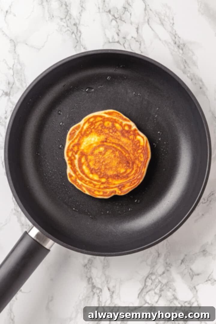 Overhead view of pancake in skillet