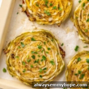 Overhead view of roasted cabbage steaks on pan