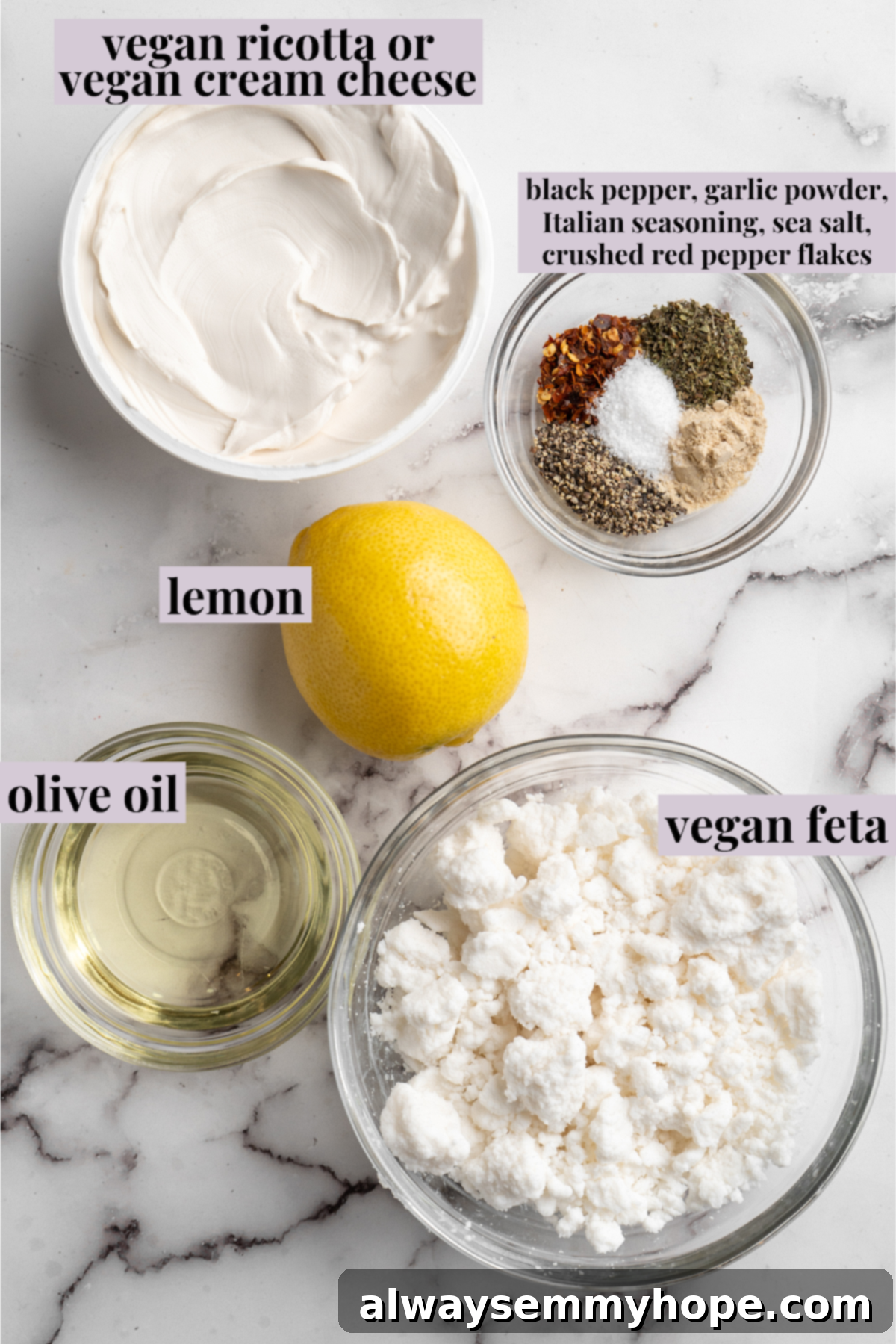 Overhead view of fresh ingredients for vegan whipped feta dip, meticulously laid out and labeled for easy identification.
