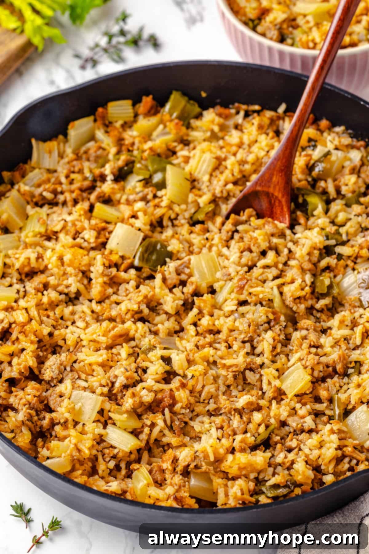 A large skillet of vibrant vegan dirty rice, ready to be dished out and enjoyed.