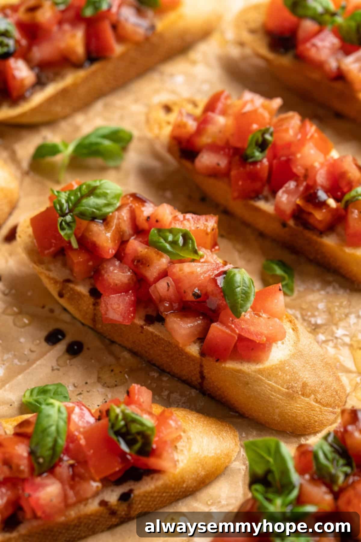 Slices of classic bruschetta presented elegantly on parchment paper, ready for serving at a gathering.
