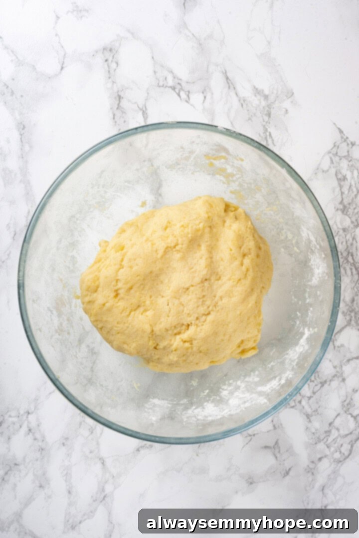 Vegan gnocchi dough in glass mixing bowl