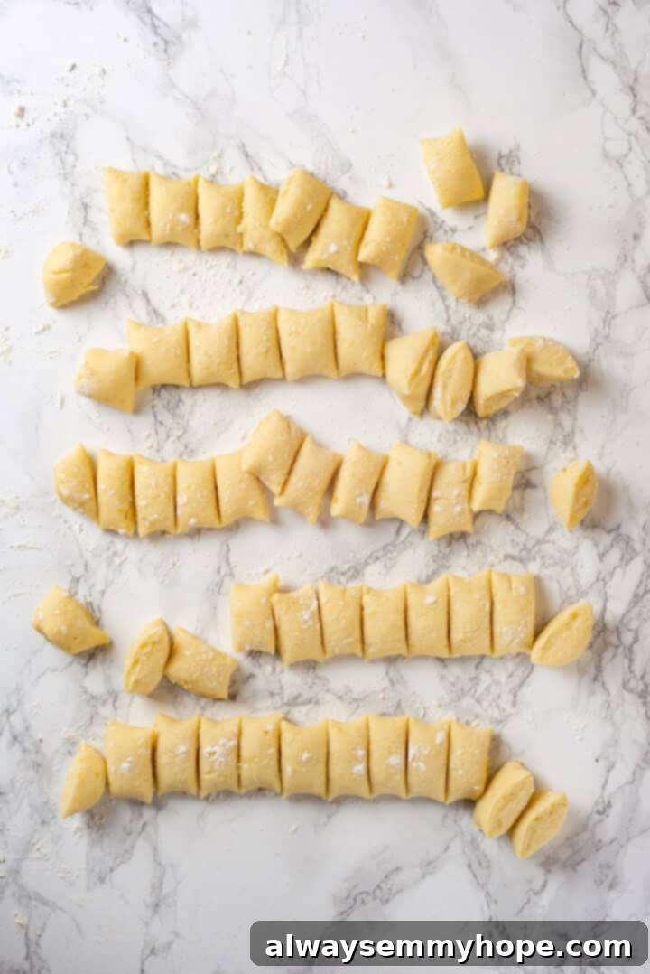 Overhead view of vegan gnocchi dough cut into pieces