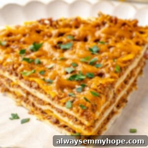 Fiesta Taco Casserole 2 Slice of layered taco bake on plate