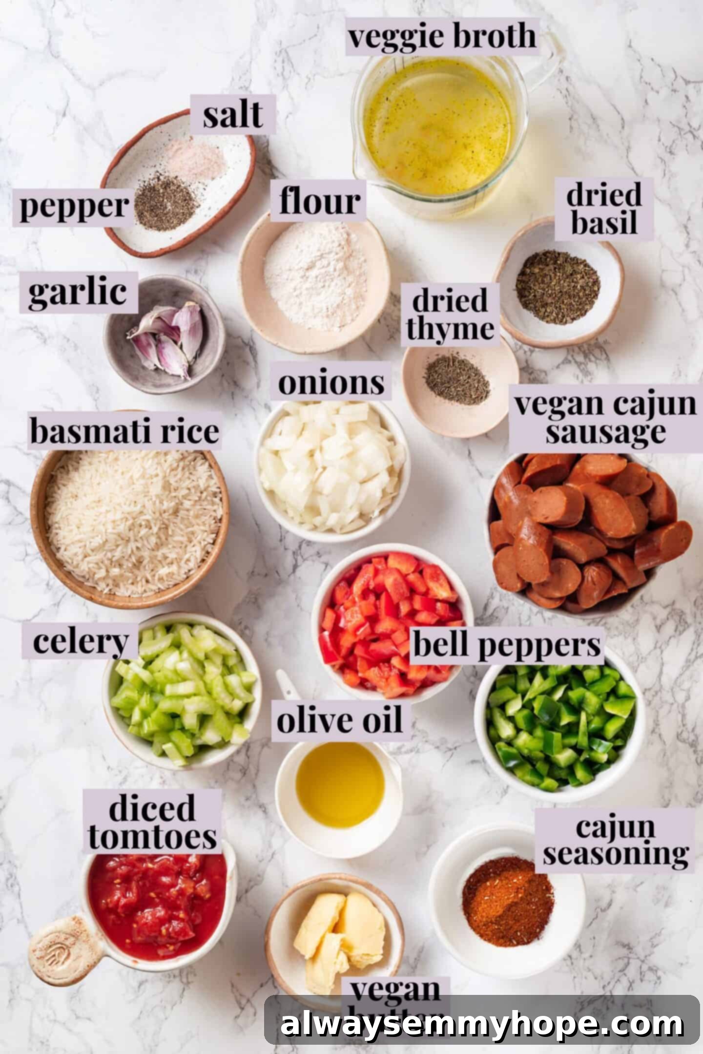 Vegan jambalaya recipe is comfort food Cajun style! With rice, veggies and plant-based sausage, this is a meal that’s flavourful and hearty. Overhead view of various ingredients for vegan jambalaya neatly arranged with labels