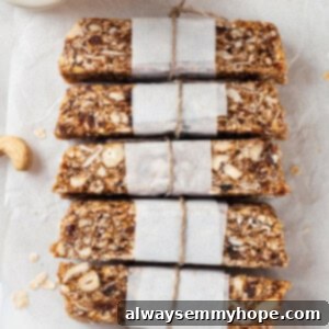 Overhead view of 5 homemade granola bars on parchment paper