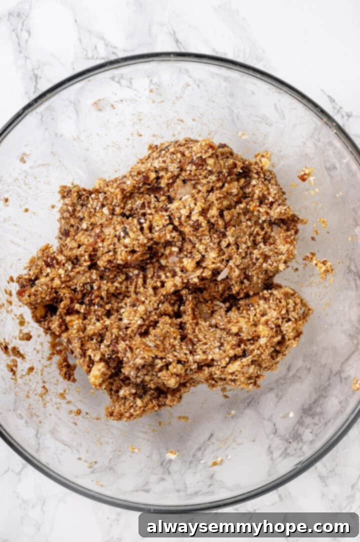 Overhead view of granola bar mixture in mixing bowl