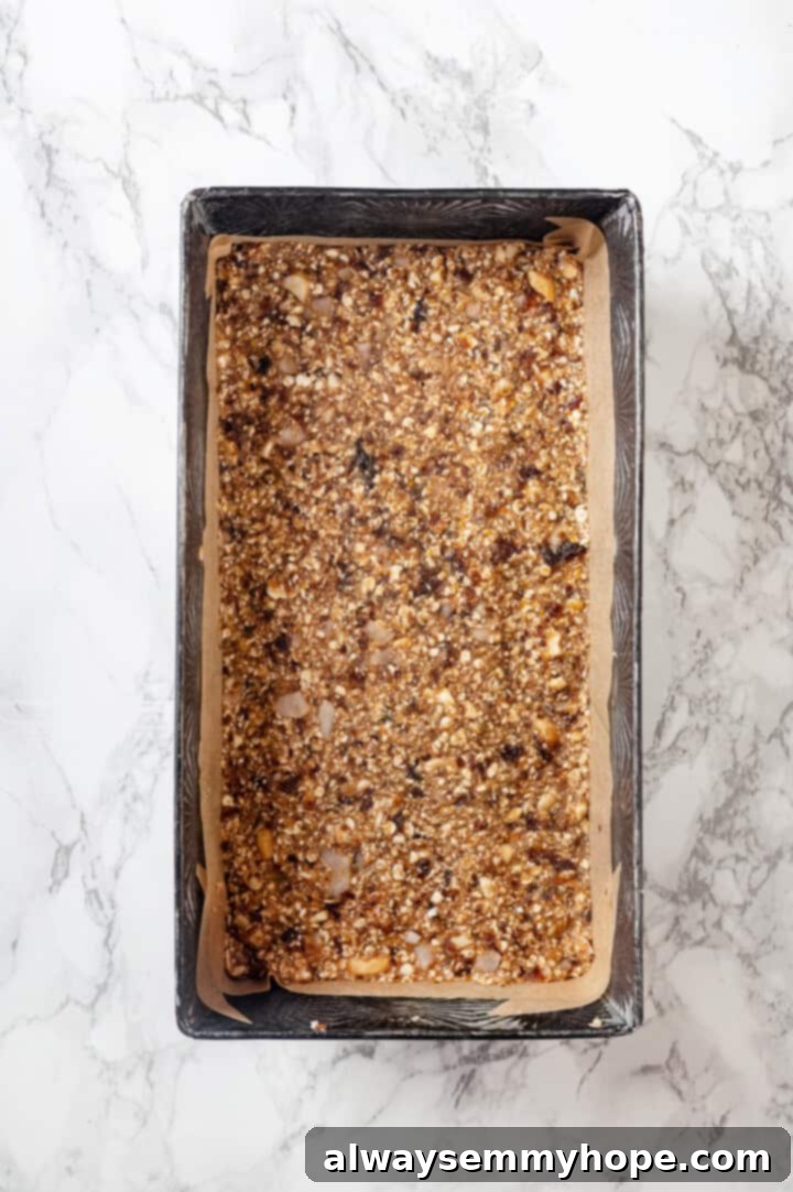 Overhead view of homemade granola bars in loaf pan
