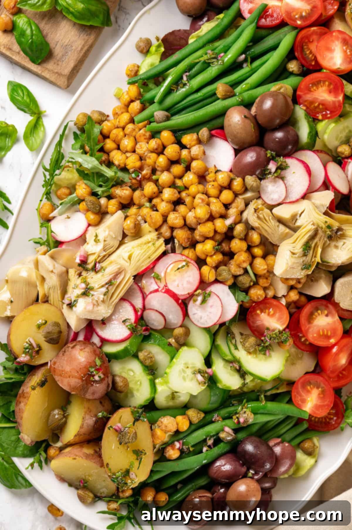 Overhead view of vegan nicoise salad with roasted chickpeas