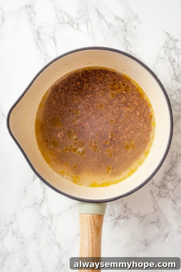 Overhead view of bulgur soaking in saucepan