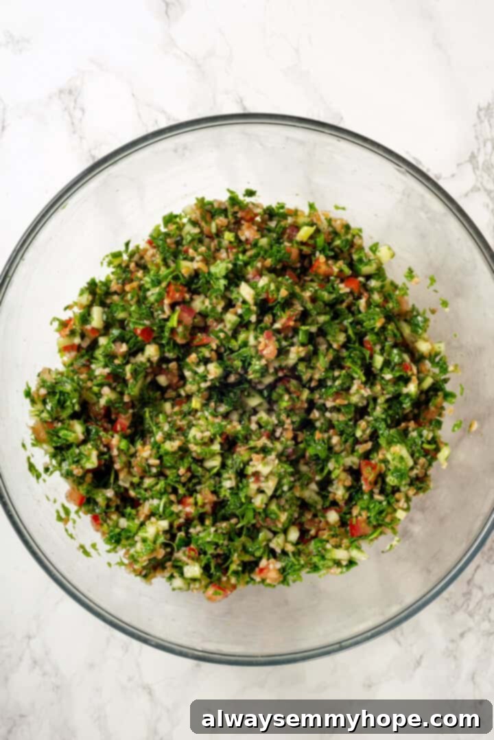 Overhead view of fully mixed tabbouleh in a large mixing bowl