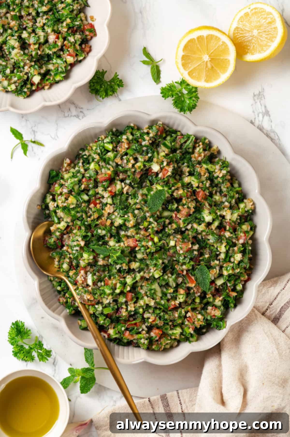 Overhead view of tabbouleh in a beautiful serving bowl, garnished with a sprig of mint