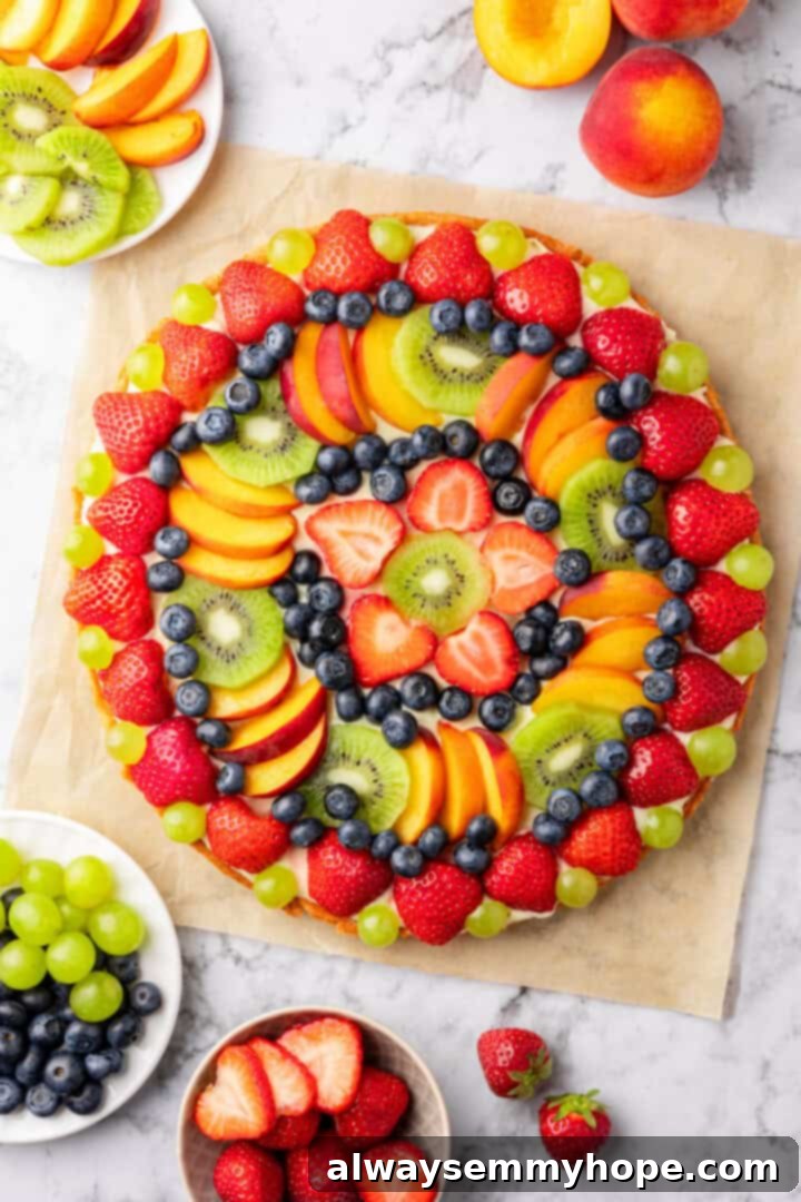 Vegan fruit pizza on parchment paper