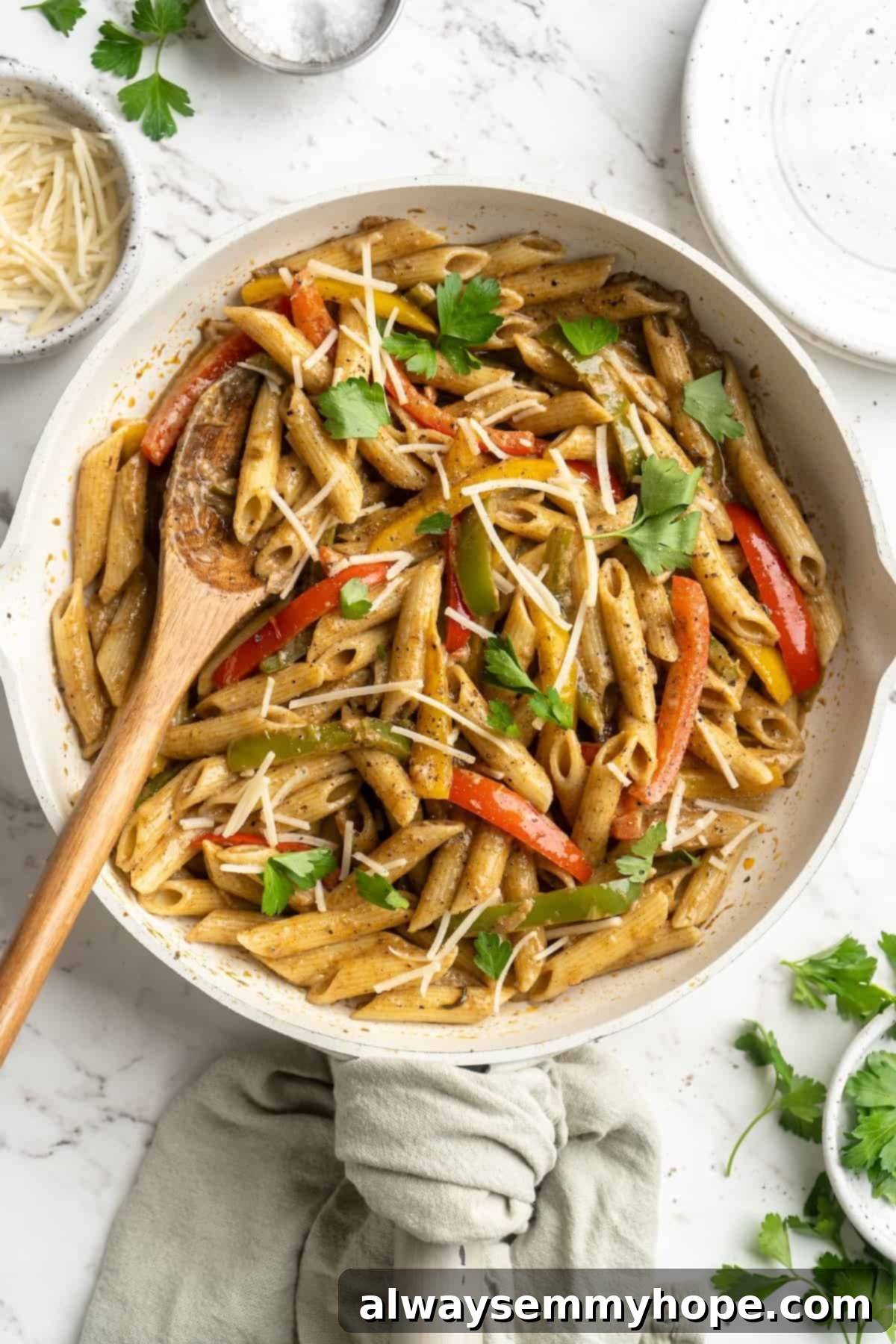 Overhead shot of Rasta Pasta in a large skillet, showing the perfectly coated penne and colorful peppers.