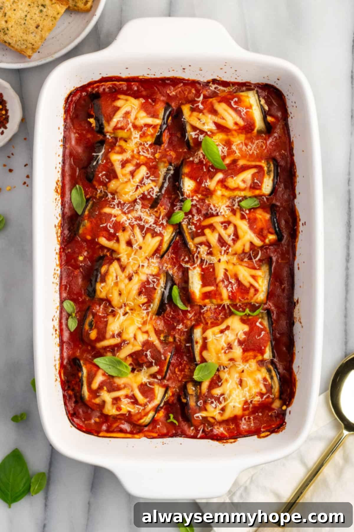 Overhead view of eggplant rollatini in baking dish