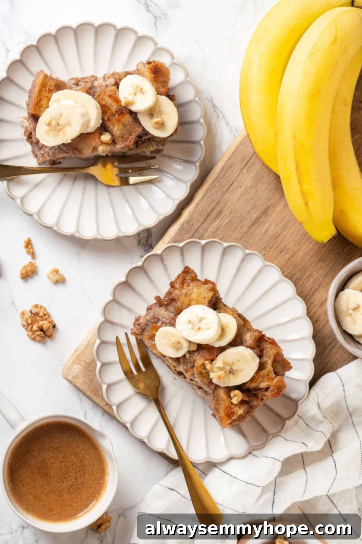 Two plates of vegan banana bread pudding, artfully garnished with fresh banana slices, presented on a wooden table with more bananas in the background, creating an inviting scene.