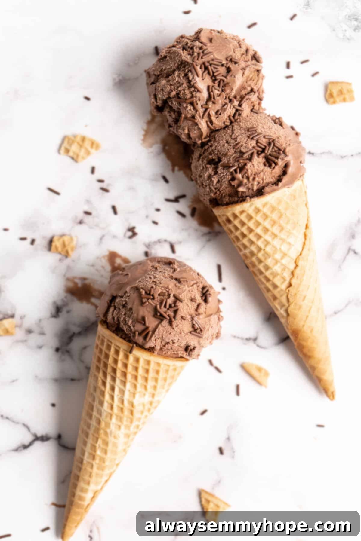 Decadent Chocolate Avocado Ice Cream 2 Chocolate Avocado Ice Cream in two cones on marble slab