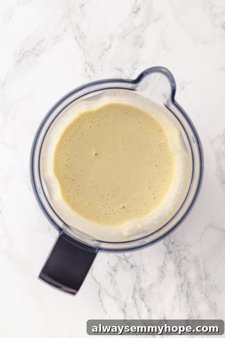 This creamy vegan pasta carbonara is a delicious plant-based alternative to the traditional recipe with mushrooms standing in for the meat! Overhead view of cashew sauce for pasta carbonara
