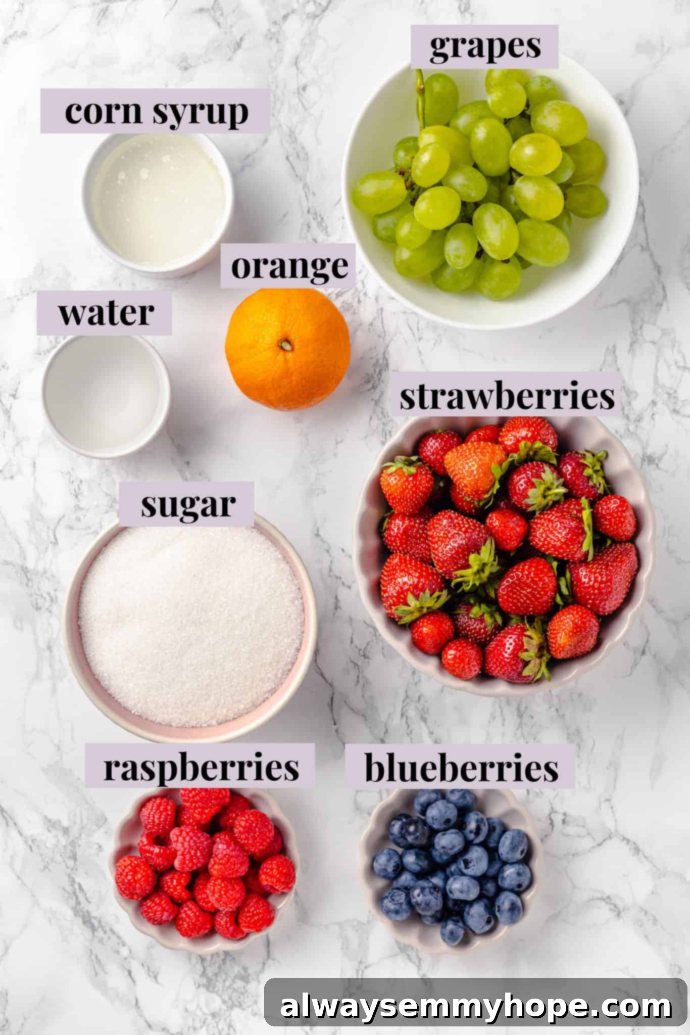 Tanghulu is one part fruit, one part candy and entirely delicious! Fruit skewers dipped in candy coating to create a sweet, crunchy shell. Overhead view of ingredients for tanghulu with labels