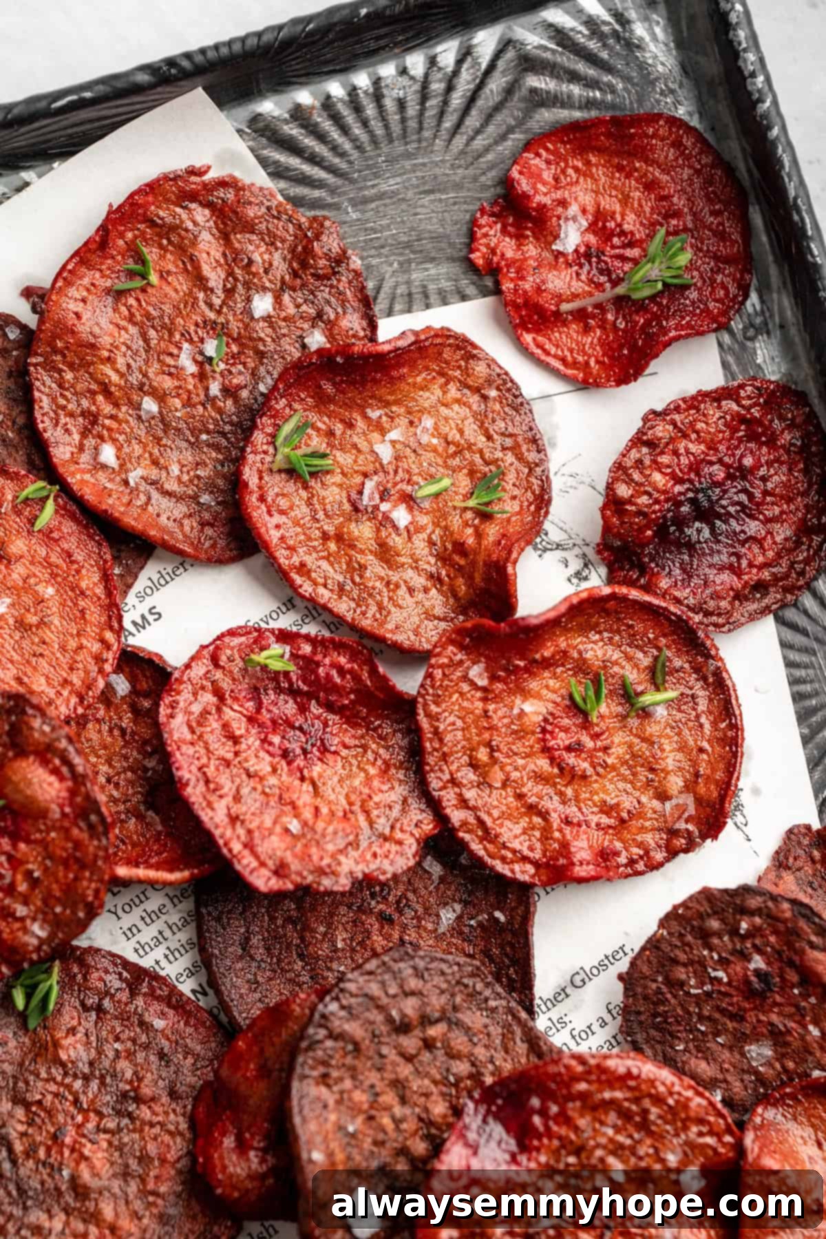 Overhead view of beet chips on baking sheet