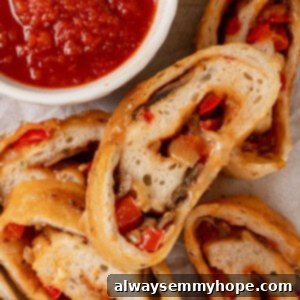 Make Your Own Delicious Stromboli 2 Overhead view of sliced stromboli with cup of marinara