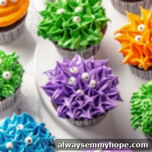 Spooktacular Halloween Cupcakes 2 Multicoloured Halloween cupcakes with monsters