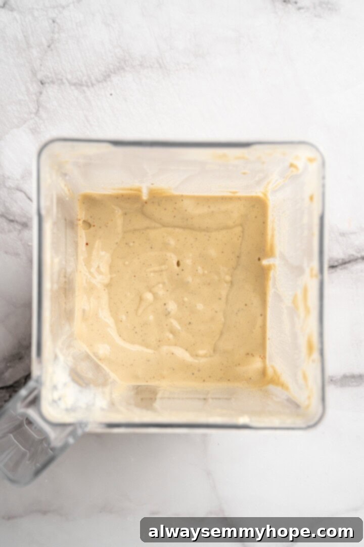 Overhead view of cashew cream in blender