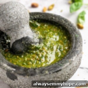 Mortar and pestle with kale and pistachio pesto