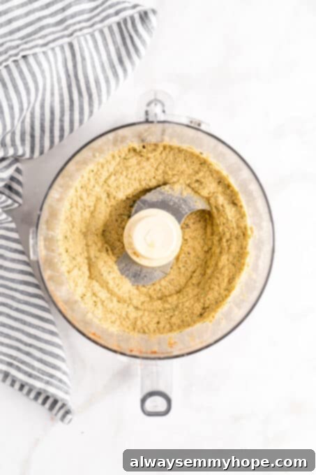 Overhead view of baba ghanoush being pureed in a food processor