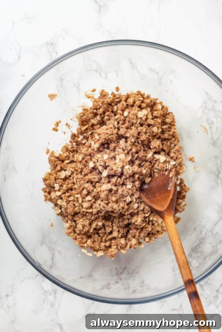 Overhead view of crisp topping in mixing bowl
