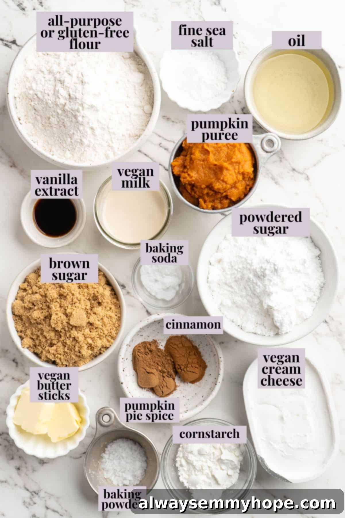 Vegan pumpkin bread with cream cheese frosting is moist, full of cozy spices and the frosting takes it over the top. So easy to make too! Overhead shot of all the dry and wet ingredients for vegan pumpkin bread and cream cheese frosting neatly arranged and labeled on a countertop.